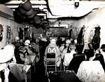 Squadron pilots being briefed before a mission in a USS Intrepid ready room, 1944-1945