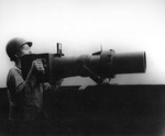 USS Intrepid Photographers Mate manning his post, date and location unknown