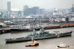 USS Iowa being pushed, New Orleans, Louisiana, United States, 23 Jan 1983; note the Superdome arena in background