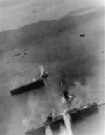 Kaiyo (center) under attack by SB2C Helldiver bombers from USS Essex, Kure, Japan, 19 Mar 1945; the carrier at bottom was either Amagi or Katsuragi
