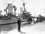Königsberg at Swinemunde, Germany, with a sentry on guard in the foreground, 1938