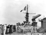 Raising of the French flag aboard the ex-USS Langley upon being commissioned as the La Fayette in the French Navy, Philadelphia Naval Shipyard, Pennsylvania, United States, 2 Jun 1951