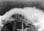 Waves splashing onto the bow of cruiser London, circa early 1942, probably as she hunted for German battleship Tirpitz