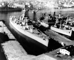 Battleship Massachusetts laid up at the Norfolk Naval Shipyard, Virginia, United States, 3 Jan 1963; note AKA-88 Uvalde at right side of photo