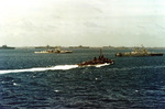 USS Shannon steaming through Ulithi anchorage, Caroline Islands, 13 Mar 1945; note USS Flint at left, USS Miami at right, carriers USS Enterprise, USS Intrepid, USS Essex, and USS Bunker Hill, and battleship Tennessee behind Intrepid.