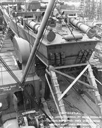PT-109 stowed on board the Liberty Ship Joseph Stanton for transportation to the Pacific Ocean, Norfolk Navy Yard, Virginia, United States, 20 Aug 1942, photo 2 of 2