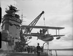 HMS Rodney lowering her Walrus seaplane, 1940