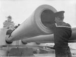 Sailors cleaning one of the 16-inch guns aboard HMS Rodney, Sep 1940