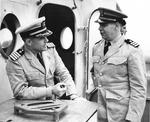 USCG Cmdr Harold S. Berdine of cutter Spencer talking with US Navy Capt Paul Heineman of the Escort Group A-3 after sinking German submarine U-175, North Atlantic, 500 nautical miles WSW of Ireland, 17 Apr 1943