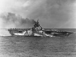 Ticonderoga being listed to port intentionally to aid firefighting efforts after being hit by kamikaze, 125 miles east-southeast of Taiwan, about 1220 hours on 21 Jan 1945