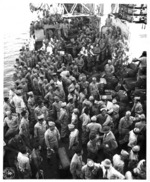 Returning Japanese-American troops of US 442nd Regimental Combat Team preparing to disembark from Victory Ship USS Waterbury Victory, Honolulu, US Territory of Hawaii, 9 Aug 1946