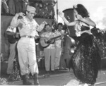 Hula dancers entertain returning Japanese-American veterans of US 442nd Regimental Combat Team aboard Victory Ship USS Waterbury Victory, Honolulu, US Territory of Hawaii, 9 Aug 1946; photo 3 of 7