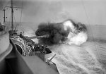 Warspite bombarding enemy positions at Catania, Sicily as seen from Warspite