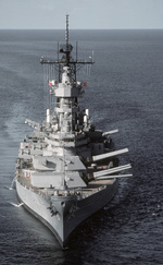 Bow view of USS Wisconsin with her main guns trained to port side, Gulf of Mexico, 30 Aug 1988
