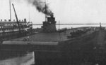 USS Wolverine during her fitting out period, summer 1942; note steamer Greater Buffalo nearby