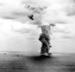 A mushroom cloud hanging above battleship Yamato