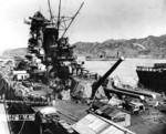 Battleship Yamato fitting out, Kure Naval Arsenal, Japan, Sep 1941; light carrier Hosho at extreme right