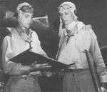 US Navy Lieutenant Commanders Joe Taylor (left) and William O. Burch, Jr. (right) standing beside a Torpedo Squadron 5 TBD-1 Devastator aircraft, Naval Air Station, Ford Island, Pearl Harbor, US Territory of Hawaii, 6 Jun 1942