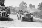 German vehicles in a town in the Soviet Union, Jun 1941; note Soviet BA-10 armored car on the side of the road