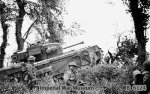 Churchill tank of 7th Royal Tank Regiment, UK 31st Tank Brigade, supporting infantry of UK 8th Royal Scots during Operation Epsom, near Caen, France, 28 Jun 1944