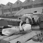 Female worker at the B. T. H. factory in Neasden Lane, Willesden in London, England, United Kingdom writing messages on a Covenanter tank of British Guards Armoured Division, 22 Sep 1942
