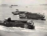 Early versions of US Army DUKWs entering the water, Europe, date unknown