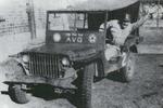 American Volunteer Group member Alex Mihalko on Ford GP vehicle, China, circa 1941