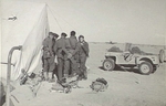 Pilots of No. 3 Squadron RAAF discussing operational plans outside their tents in Libya