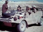 Kübelwagen vehicles of the German Afrikakorps operating in desert conditions, 1940-1943, photo 2 of 3; note the oversize tires that offered better performance on soft surfaces like sand