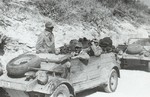 Kübelwagen vehicles of the German Afrikakorps operating in desert conditions, 1940-1943, photo 1 of 3; note the oversize tires that offered better performance on soft surfaces like sand