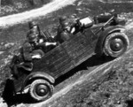 Kübelwagen loaded with troops showing its versatility on uneven terrain during testing, circa 1940