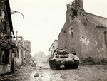 M10 tank destroying in a heavily damaged town, Europe, 1944-1945