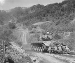US Marines crouching behind a M26 Pershing tank, near Hongcheon, Korea, 22 May 1951