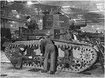 British workers working on a M2A4 light tank that had just arrived from the United States, circa 1941