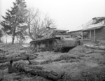 Wrecked Panzer III tank and killed German tanker at Skirmanovo near Moscow, Russia, circa 1942
