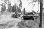 Two German Tiger I heavy tanks in a forest near Lake Ladoga, northwestern Russia, Aug 1943