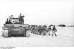 German soldiers and Tiger I heavy tank on a snowy road in Eastern Europe, Jan 1944