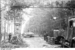 German Army Tiger I heavy tank under repair in a camouflaged repair facility, Russia, summer 1944, photo 1 of 2