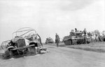 Crew of a German Tiger I heavy tank resting beside a road during Battle of Kursk, Russia, Jul 1943, photo 1 of 2