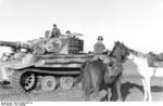 German Tiger I heavy tank and a horse-mounted German soldier in Russia, spring 1944