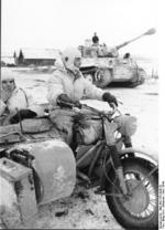 German Army PzKpfw VI Tiger I heavy tank and motorcycle, Russia, Mar 1944