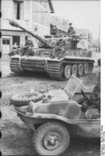 Tiger I heavy tank of the German 1st SS Division Leibstandarte SS Adolf Hitler and Schwimmwagen vehicle in Morgny, France, 7 Jun 1944, photo 2 of 3