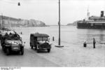 German SdKfz. 250 halftrack vehicle in a port in Southern France, 1942; note passenger ship Maréchal Lyautey in background