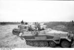 A German Luftwaffe Oberleutnant (Senior Lieutenant) performing air traffic control in the field in a specially-modified SdKfz. 251 vehicle, Russia, Oct 1943, photo 4 of 4; note MG34 and Panzer IV