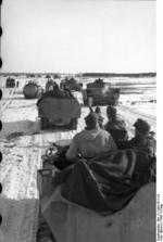 German SdKfz. 251 halftrack vehicles and Panzer IV tanks in Russia, 21 Mar 1944, photo 1 of 2