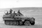 German troops observing the field in a SdKfz. 251 halftrack vehicle, southern Russia, Aug 1942