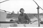 A German Luftwaffe Oberleutnant (Senior Lieutenant) performing air traffic control in the field in a specially-modified SdKfz. 251 vehicle, Russia, Oct 1943, photo 1 of 4