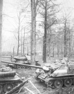T-34-85 tank and SU-100 tank destroyer of Soviet 1st Guards Tank Army outside of Berlin, Germany, 30 Apr 1945