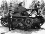 Soviet officers inspecting a T-26 light tank that had previously been captured by Finnish troops, date unknown