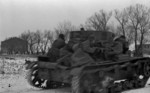 Soviet troops using a T-26 Model 1933 tank for cover, near Korsun-Shevchenkovski, Ukraine, Jan-Feb 1944